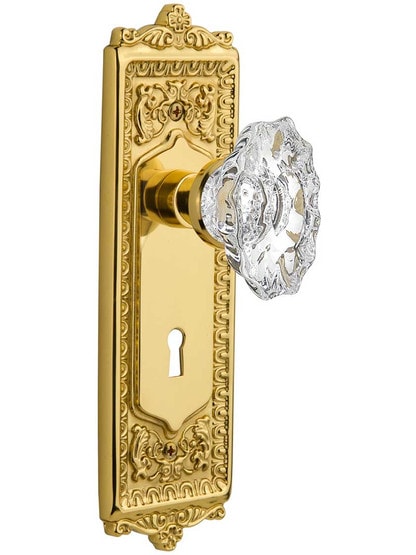 Egg and Dart Design Door Set with Keyhole and Chateau Crystal Glass Knobs in Polished Brass.